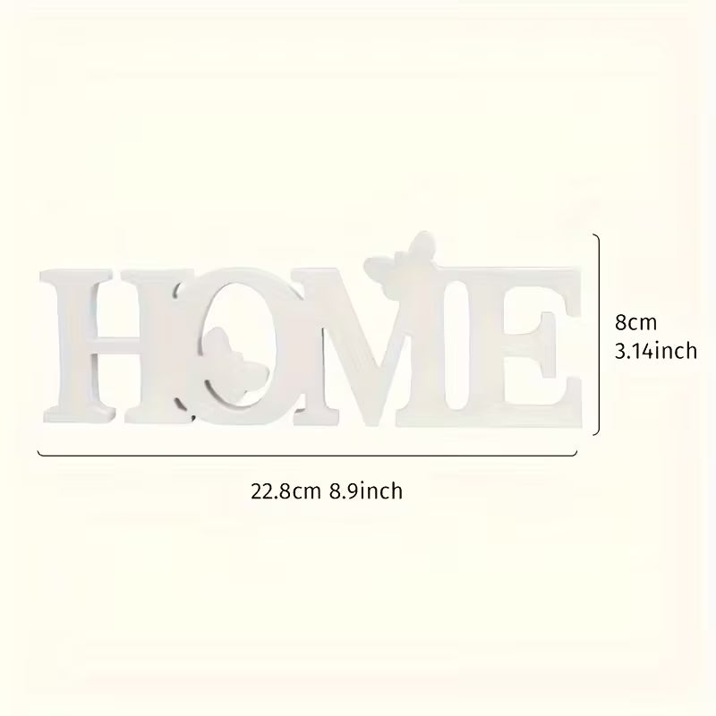 Interjero dekoracija su užrašu HOME – modernus namų dekoro elementas